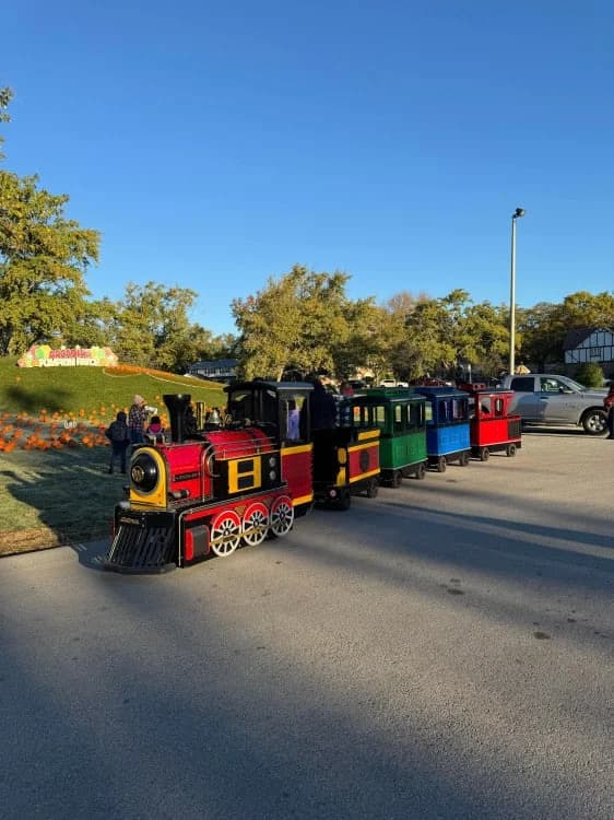 Northern Lights Express trackless train at an outdoor festival-style event in Edmonton, Alberta